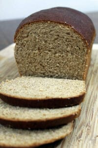 Molasses Whole Wheat Bread on wooden cutting board