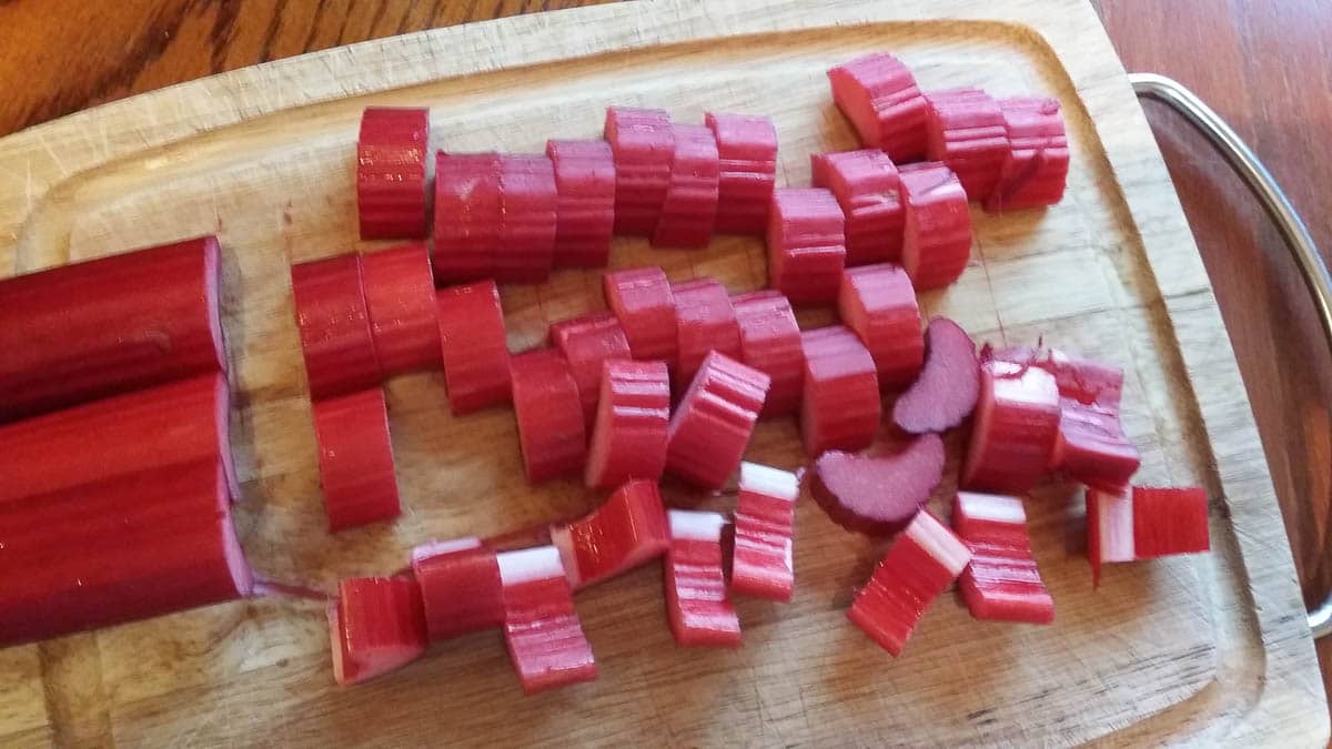 sliced rhubarb on wooden cutting board