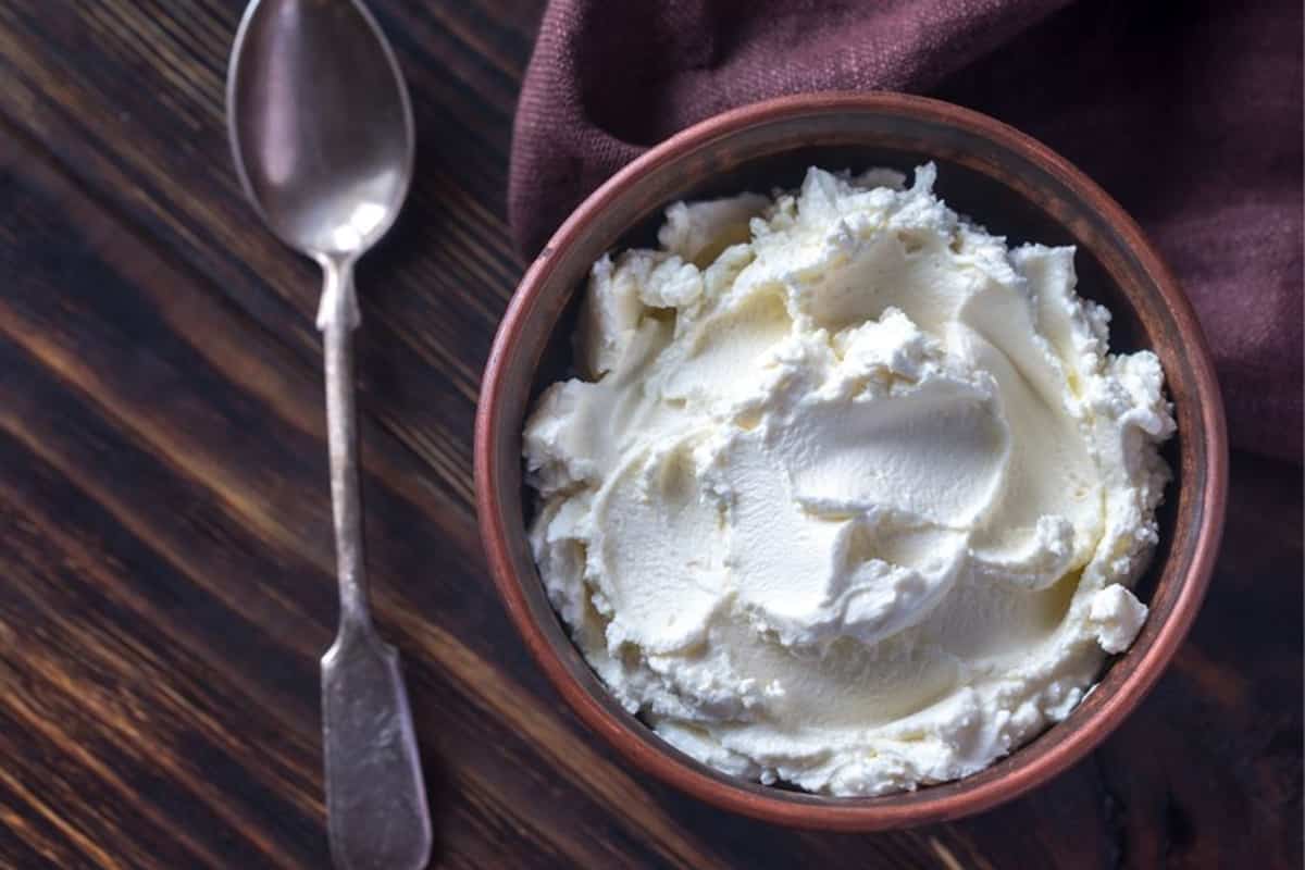 cream cheese in bowl with spoon