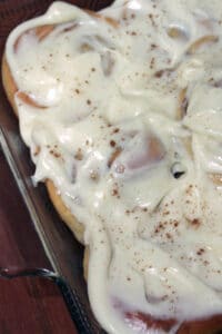Sourdough Cinnamon Rolls with Cream Cheese Icing in baking pan on table