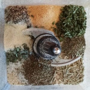 breadcrumbs and herbs in food processor bowl