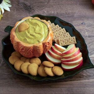 Pumpkin dip in orange bowl with dippers.