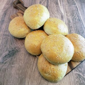 Hamburger Buns on a wooden table.