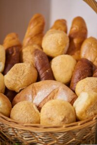 Different kinds of breads in a wicker basket