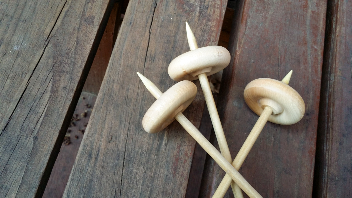 Set of three drop spindles.
