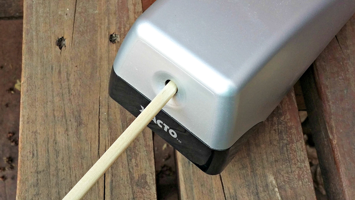 Wooden dowel inserted into pencil sharpener.